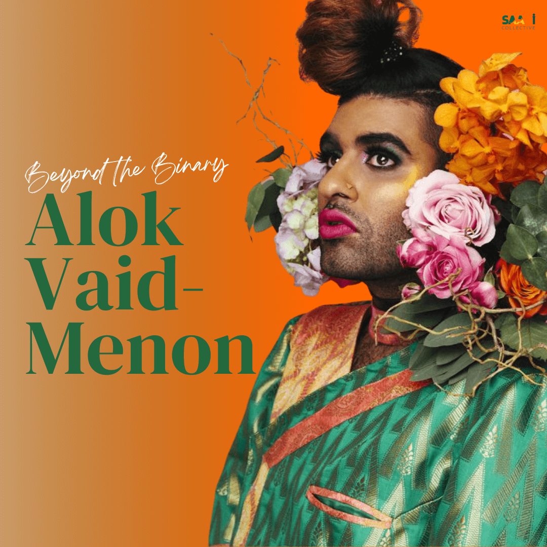Transfeminine performer Alok Vaid-Menon is adorned with flowers on their shoulders and around their head. They were sparkling, vibrant make-up and a similarly shimmering green and gold garment made of south Indian fabric.