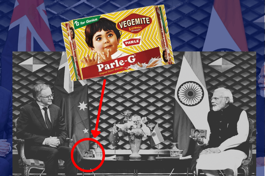 Australia Prime Minister Anthony Albanese sitting with Indian PM Narenda Modi while a packet of Vegemite Parle-G sits on their table, highlighted by a super-imposed version of the picture above it. Text: 'BREAKING NEWS. Vegemite Parle-G? The Secret Reason For PM's Visit to India'