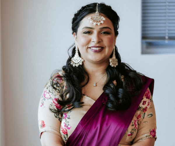 Portrait of Megha Tripathi, founder of Kifaayat, in South Asian traditional wear.